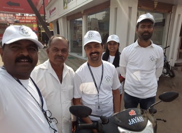 a group of men and a woman standing around a motorcycle