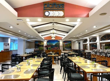 a restaurant with a long table and chairs cozy atmosphere