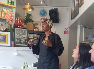 Jamila giving talk about Mangrove Nine