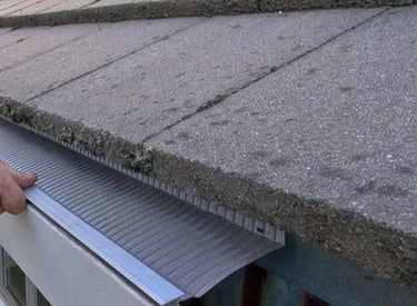 gutter guards being installed by studs gutters