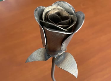 a metal flower on a table 