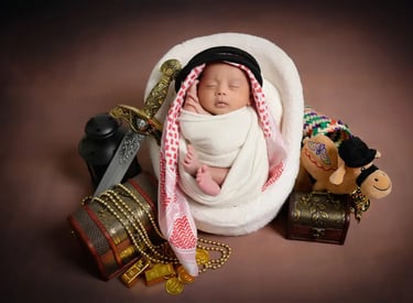 a newborn boy is wrapped in a blanket