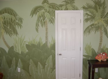 A playful Florida scrub palms and palms interior wall mural in a mutlitude of greens painted by Kathy LaFollett.