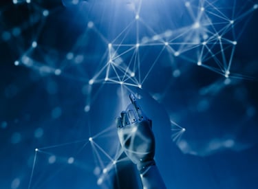 a person holding a cell phone in front of a blue sky