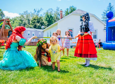 Ariel and Moana play limbo with kids at a party