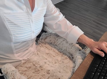 Lady at computer with Furr Lap Pet Bed in her lap 