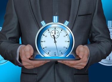 a man in a suit and tie holding a clock