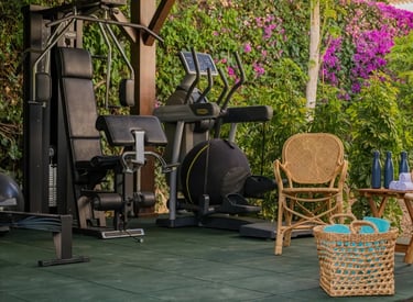 Outdoor gym amid tropical gardens at Villa El Olivo, Marbe