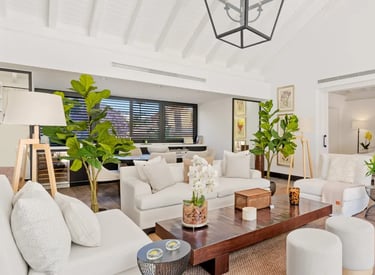 Bright open-plan living room with neutral décor and natural light at Villa El Olivo, Marbella