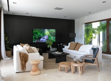 a living room with a television and a flat screen tv