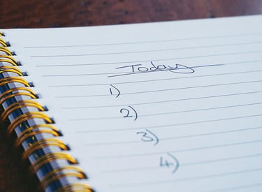 a notepad with a note pad and a pen on it