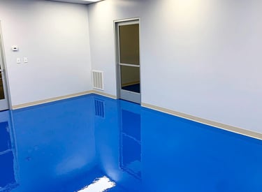 Solid color epoxy floor in commercial room