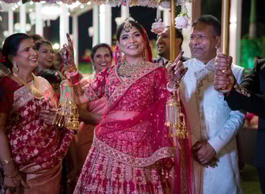Bride in red lehenga at her wedding.