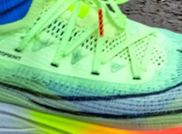 a person wearing a pair of Nike Alphafly trainers