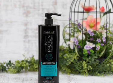 360 Spin Photography - a bottle of hair products with a bird in the background