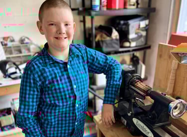 Jackson with his new lathe in his workshop