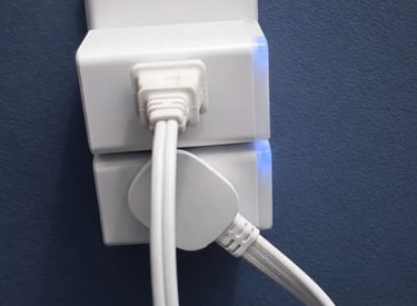 Low profile outlet extender allowing plugs to sit flush against the wall