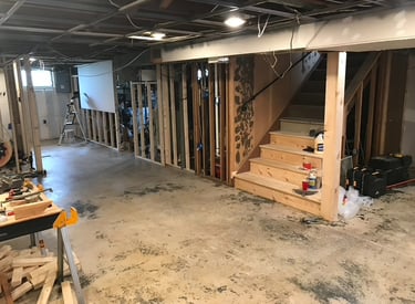 Basement renovation with staircase and open walls in Pennsauken, NJ