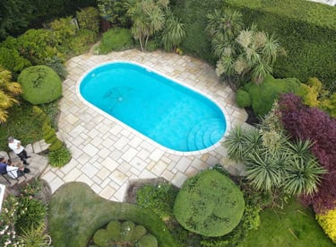 An aerial photograph of a completed swimming pool project