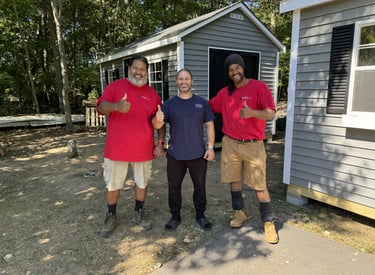 Imperial Custom Sheds crew with satisfied customer after successful on-site shed installation