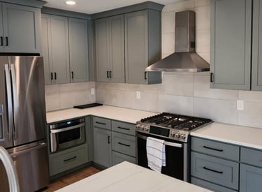 a kitchen with a stove top oven and a refrigerator