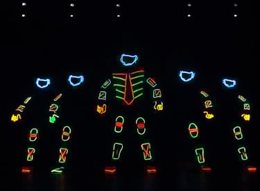 Neon tron act performing illusion show by the glowdiators