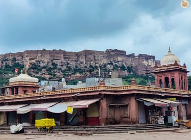 Mehrangarh Fort towering above the closed shops of Sardar Market in Jodhpur’s Blue City on a peaceful morning.