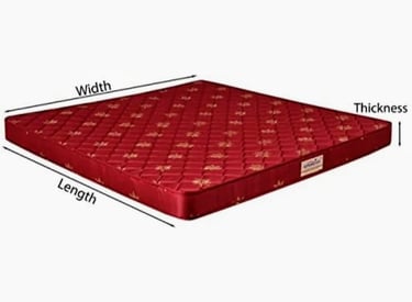 a mattress with a red coverlet and a white background