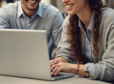A friendly advisor speaking with a student over a laptop screen.