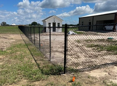 Black Metal Fence in a Backyard