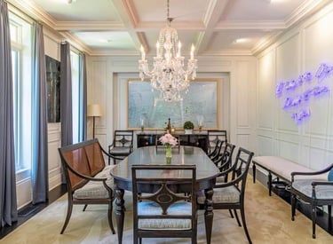 Sofia Richie dining room with chandelier and elegant modern decor.