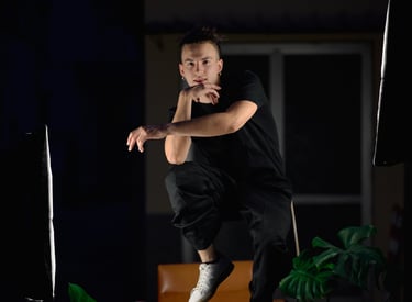 a man in black shirt jumping in the air