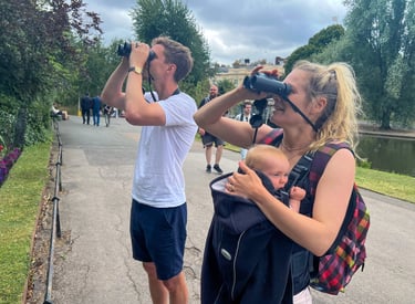 Husband, wife and baby daughter experiencing a Goldcrest - the smallest bird in the UK - at close quarters in Regent's Park.