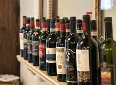 a row of bottles of wine on a shelf