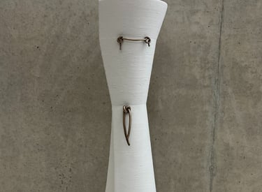 Tall & elegant ceramic vessel in 3d printed white porcelain, with bronze knot details