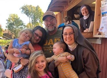 A family receiving help from the Rose Garden Mission
