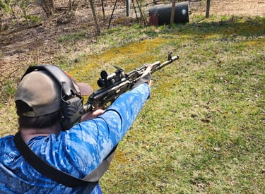 Man using self-defense firearm on range.