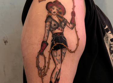 american traditional pinup style cowgirl tattoo inked