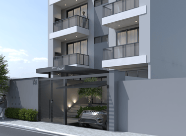 a modern apartment building with a car parked in front of it