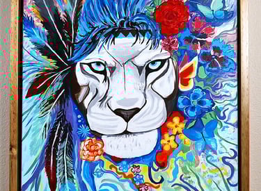 a painting of a lioness with a flower in her hair. 20" x 24" canvas.