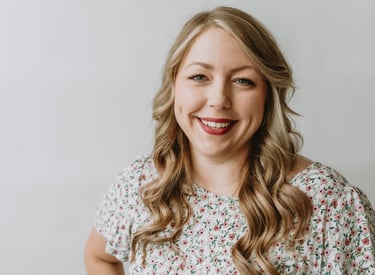 a woman smiling with blonde hair