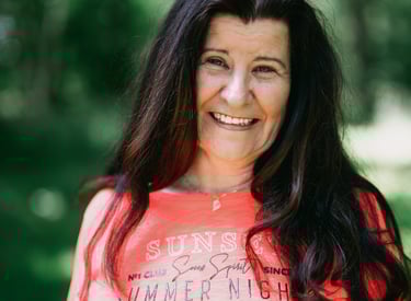 a woman in a bright orange shirt and a red shirt