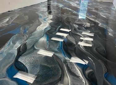 High-gloss metallic epoxy floor in commercial showroom