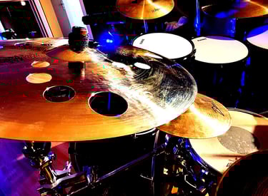 a drum kit with a drum set up in a recording studio