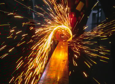 grinding and deburring a metal part