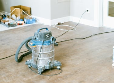 Post-construction cleaning equipment preparing a renovated room for a dust-free, move-in ready finis