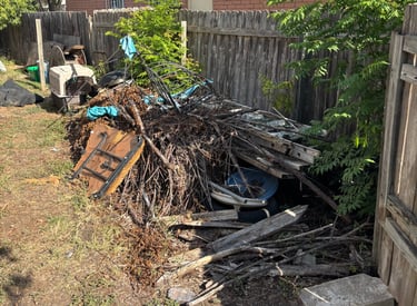 backyard in fair oaks ranch full of branches and backyard debris