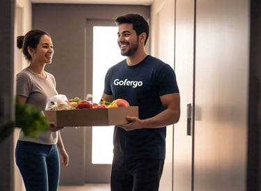 A delivery person wearing a grey tshirt carrying a grocery items to be deliver to the customer