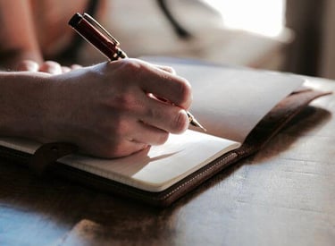 A person setting goals in a planner.