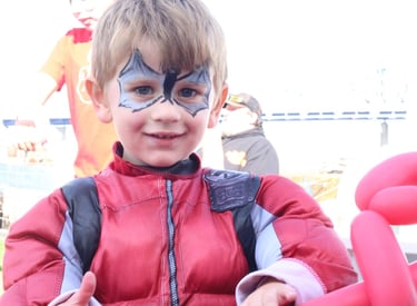 Little boy showing his face paint